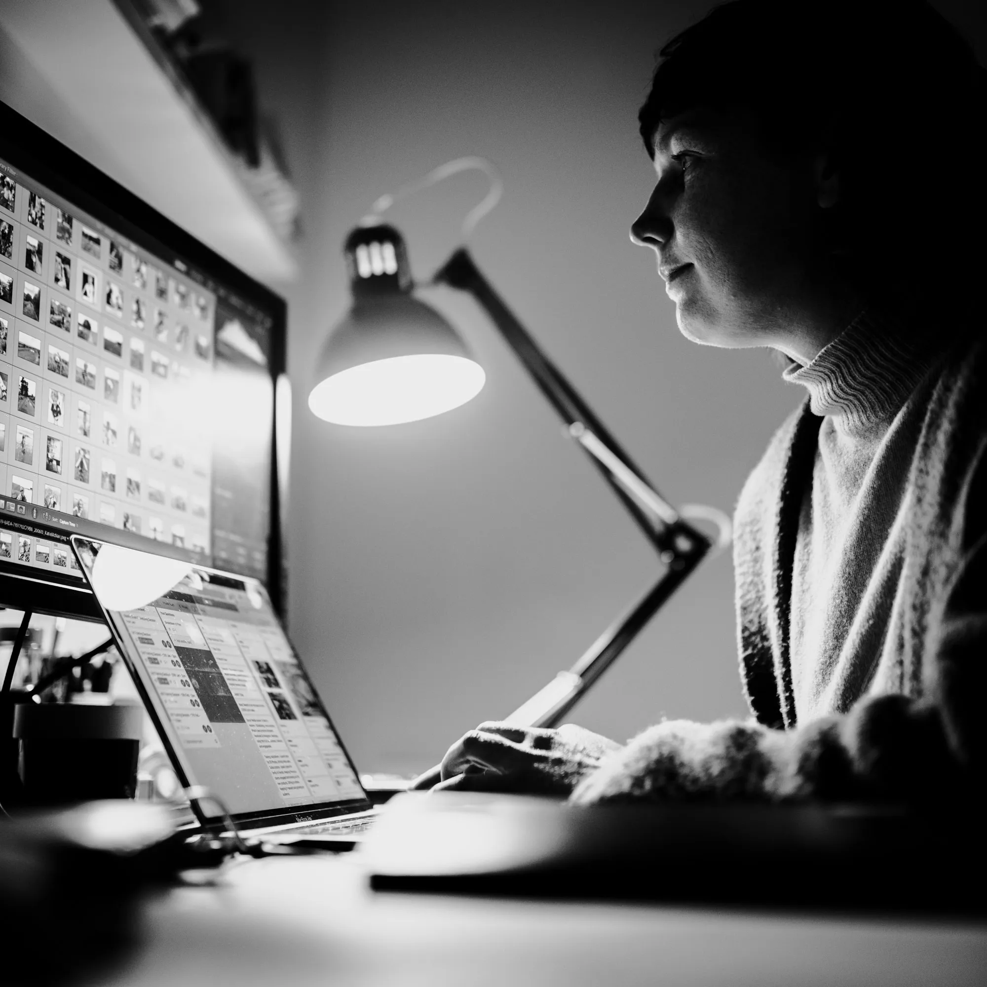 Jo reviewing a photographic archive at her desk